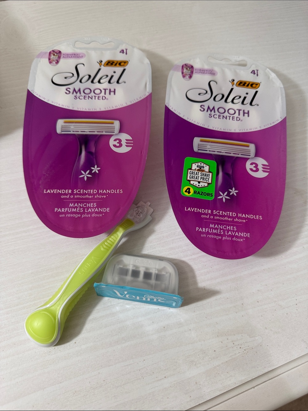 2 x Soleil Smooth Razors in White and Purple and 1 x venus